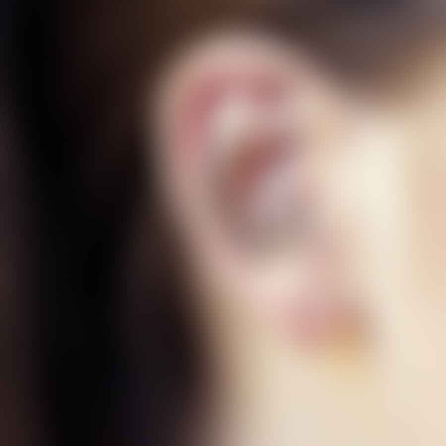 A close-up image of a daith piercing
