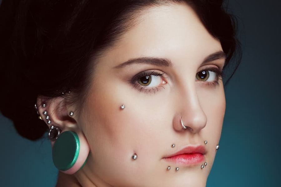 cheekbone dermal piercing