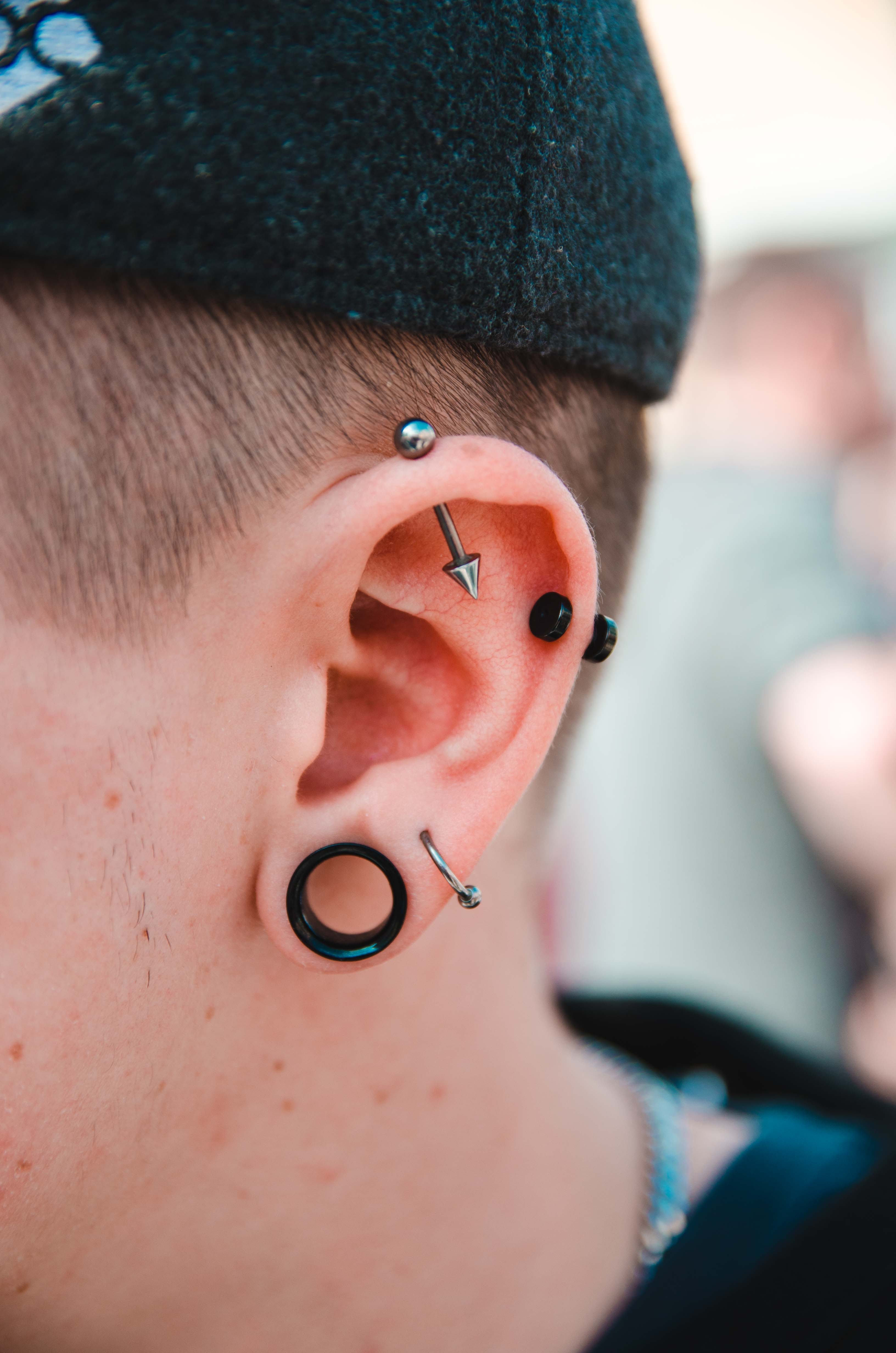 Close-up view of a fresh lobe piercing showing the need for proper care and healing time